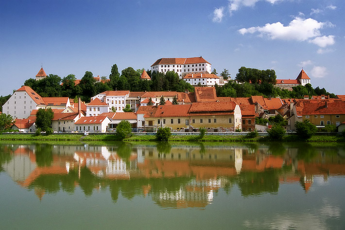 View across the river Drava to the old town of Ptuj with the castle on the hill